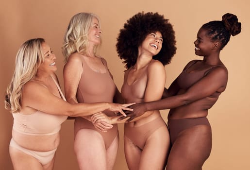 Support, love and diversity of women in underwear, beauty collaboration and smile for body positivity against brown studio background. Community, care and model people with solidarity and confidence.