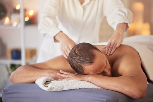 Spa, man and massage for wellness, luxury and relax for health, peace or lying on table. Male person, rich and self care for healthy lifestyle, zen treatment or grooming for stress relief and healing.