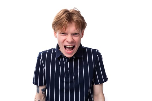 close-up portrait of a stylish handsome young blond man keeping a secret on a white background.