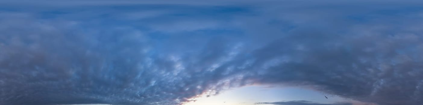 Bright sunset sky panorama with Cirrus clouds. Seamless hdr spherical equirectangular 360 panorama. Sky dome or zenith for 3D visualization, game and sky replacement for aerial drone 360 panoramas.