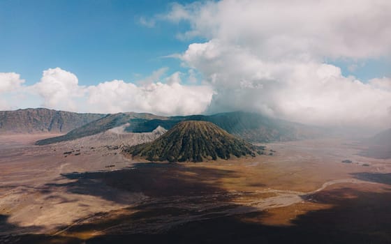 Landscape view of bromo volcano with cloudy sky. Misty bromo tengger Semeru National Park