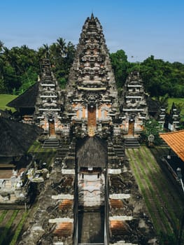 Aerial view of beautiful complex traditional Hinduism stone balinese temple. Holy asian pura architecture, Indonesia