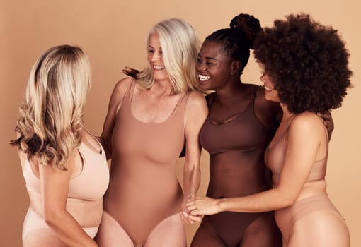 Diversity, beauty and group of women in lingerie in studio isolated on a brown background. Underwear, self love and body positivity, empowerment and confident happy friends with different body types