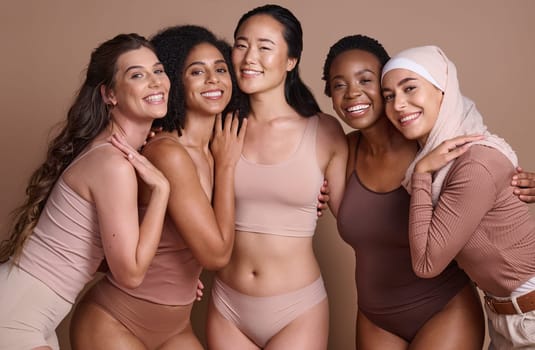 Diversity, women and body positive support in studio for body care wellness, beauty and skincare portrait. Interracial, group of people and cosmetics self care dermatology for models in underwear.