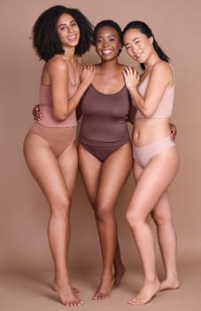 Girl friends, diversity and body positivity model group hug for portrait showing beauty and skincare. Underwear, happiness and glow of women together for dermatology and skin wellness support.