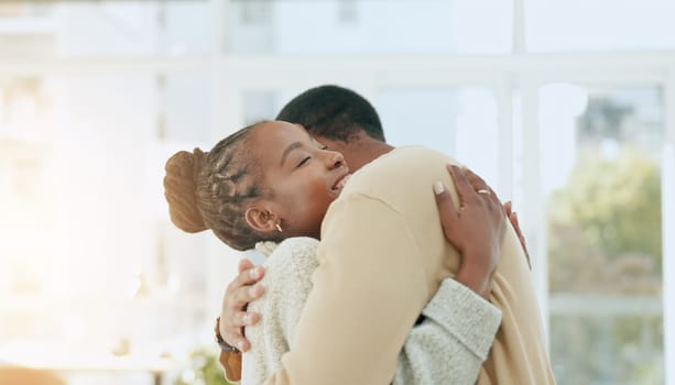 Black couple, dance together and hug in home with conversation, care and love with bonding. Man, woman and dancing with support, talking and romance with solidarity in house with trust in partnership.