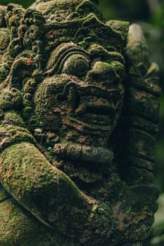 Stone sculpture in sacred monkey forest. Balinese architecture carved stone, monkey sanctuary decoration statue