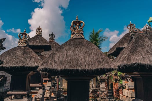 Photo of traditional balinese pavilions. Indonesian hindu temples with specific bali architectural details