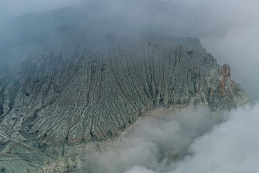 Top view of blue lake in the mountains. Scenic beautiful view of lagoon surrounded by hills