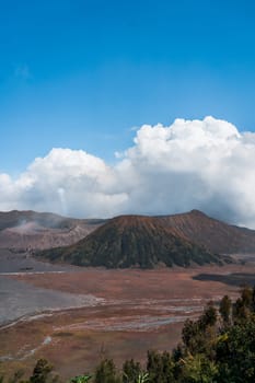 Landscape view of bromo volcano with cloudy sky. Misty bromo tengger Semeru National Park