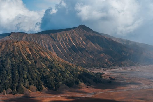 Landscape view of bromo volcano with cloudy sky. Misty bromo tengger Semeru National Park