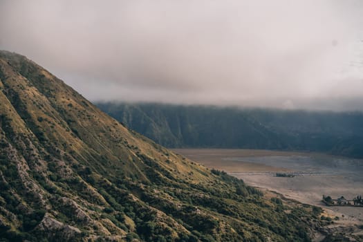 Bromo Tengger National Park in Indonesia. Semeru mountain and volcanic landscape view in fog