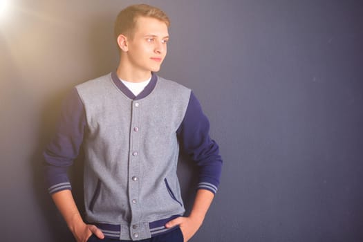 portrait of a young man on black background