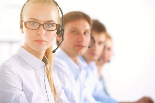 Attractive positive young businesspeople and colleagues in a call center office.