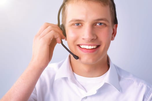 Call center male operator on gray background