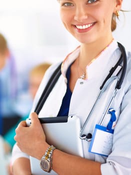 Woman doctor standing with stethoscope at hospital .