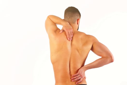 Young man holding his neck in pain. Medical concept.