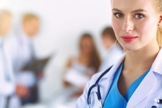 Woman doctor standing with stethoscope at hospital .