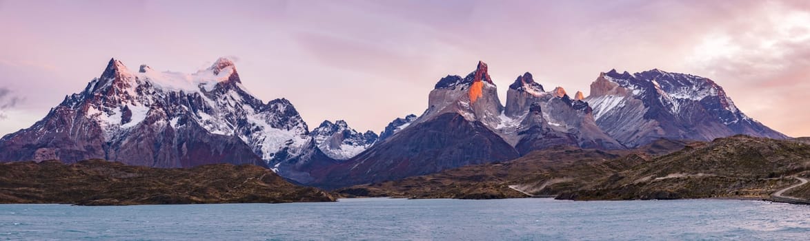 Panorama of the remarkable mountain peaks of the mountain massif at Torres del Paine National Park in the morning light, Patagonia, Chile, South America