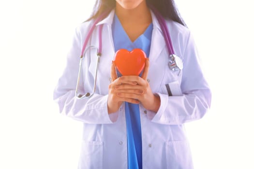 Female doctor with stethoscope holding heart, isolated on white background