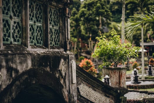 Close up shot of balinese building architecture with decorative details. Indonesian ancient old garden