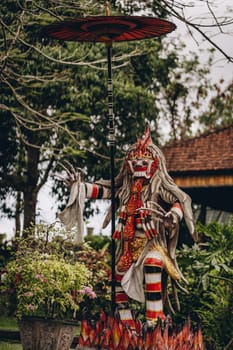 Close up of statue with barong colorful mask. Traditional balinese culture, king of spirits and souls