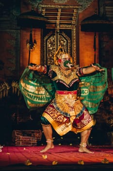 Unrecognisable Balinese artist dancing with show mask. Traditional bali cultural performance, religious dance ritual