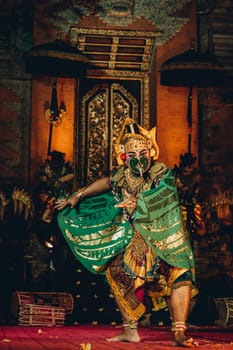 Unrecognisable Balinese artist dancing with show mask. Traditional bali cultural performance, religious dance ritual