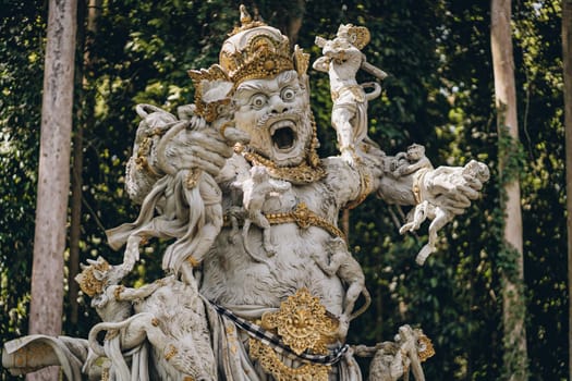 Close up shot of Monkey King statue in sacred monkey forest. Ancient balinese sculpture, hindu religion