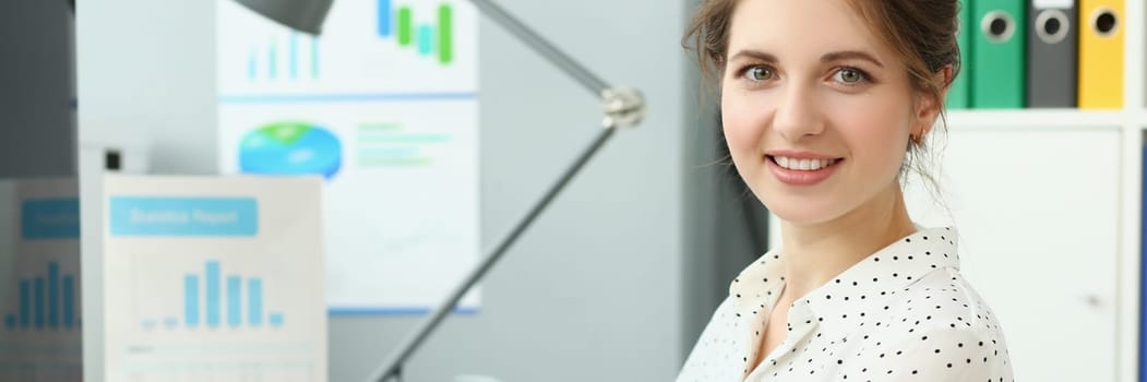 Portrait of beautiful businesswoman at workplace in office. Business consultant manager boss or marketer