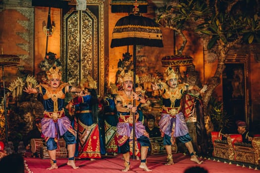 UBUD, BALI, INDONESIA - FEBRUARY 10, 2023: Traditional dance Legong and Barong in Ubud Palace is performed by local professional actors with colorful clothes, expressive gestures, facial expressions