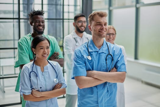 Professional Multinational Doctors Camera Posing. Diagnostic Discussion. Clinician Group. Working Together. Office Friendship. Teamwork Connection. Hospital Team. Cheerful Medicians.