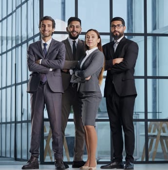 a group of different business people in an office lobby.