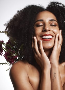 Peace, skincare and makeup girl with flowers satisfied with beauty and glowing texture routine. Aesthetic, health and wellness of confident black woman with beautiful smile in white studio