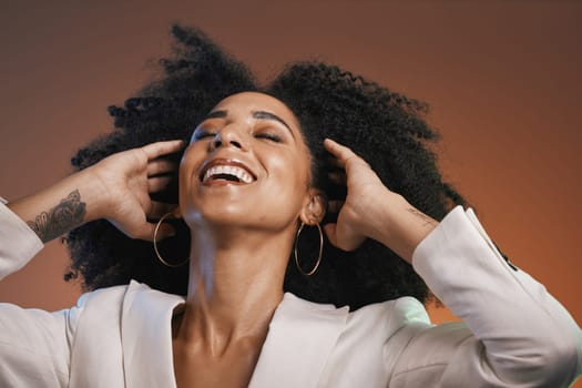 Hair care, beauty and black woman with makeup, hair and happy with afro and cosmetic care, face and skincare. Hairstyle with facial, natural curly hair texture and pride against studio background.