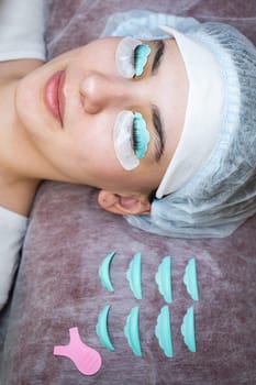 Portrait of a woman in a beauty salon on the procedure of eyelash lamination