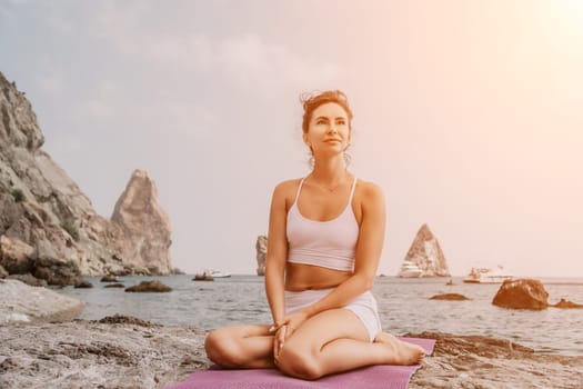 Fitness woman sea. Outdoor workout on yoga mat in park near to ocean beach. Female fitness pilates yoga routine concept. Healthy lifestyle. Happy fit woman exercising with rubber band in park.