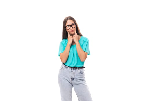 young well-groomed brunette European lady with straight hair is dressed in casual clothes wears eyeglasses.