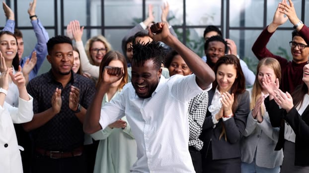 Portrait of business and advertising team, laughing and clapping