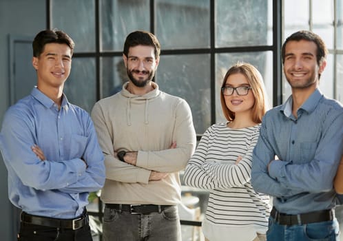 Successful team of young perspective businesspeople in office