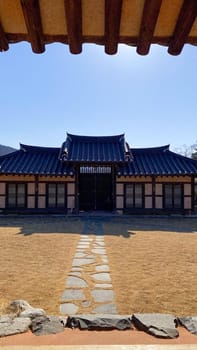 sky,shade,facade,property,wood,landmark,leisure,wall,architecture,building,courtyard,home,house,roof,shrine,temple