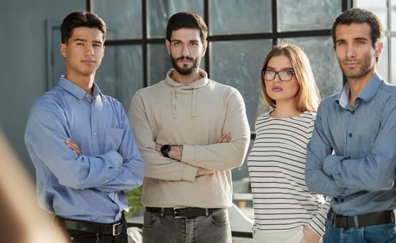 business people standing and looking straight ahead in a modern office
