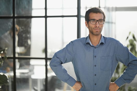 Confident businessman in casual wear in the office