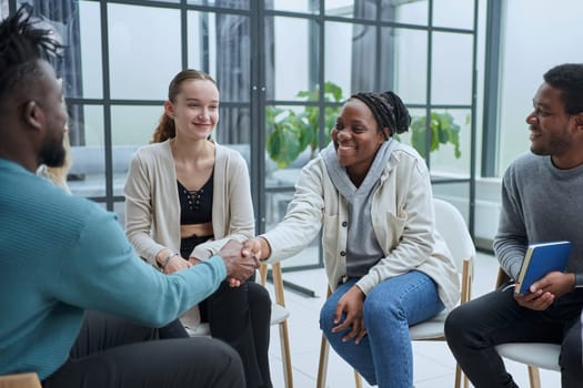 Different groups of people communicate with each other during business seminar or training.