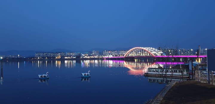 architecture,bridge,city,evening,horizon,lighting,night,reflection,river,sky,water,waterway