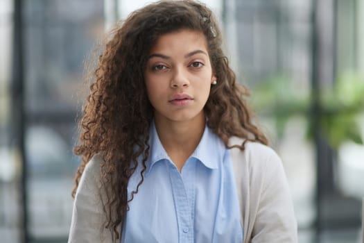 girl standing at modern office looking at camera