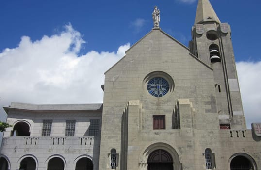 sky,door,city,tree,facade,house,building,cloud,plant,window,architecture,chapel,church,landmark,parish,steeple