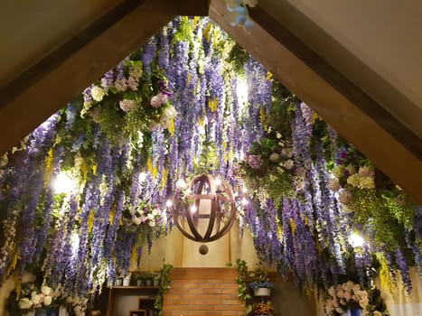 ceiling,tree,building,flower,symmetry,plant,purple,decoration,architecture,lighting