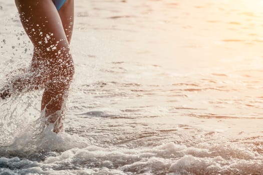 Running woman. Female runner jogging during the sunrise on beach. Woman Runner feet running on the beach at sunrise. woman fitness sunrise jog workout wellness concept.