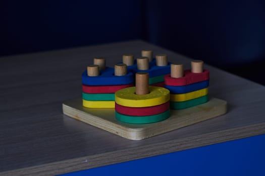 Photo of children's sorter wooden base with plastic figures. Educational and educational toys. Childhood. Training.